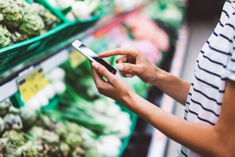 in-store grocery shopping: activating coupon on mobile phone